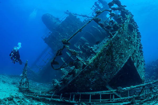 Scuba diver exploring the SS Thistlegorm wreck in Egypt’s Red Sea on a liveaboard trip.